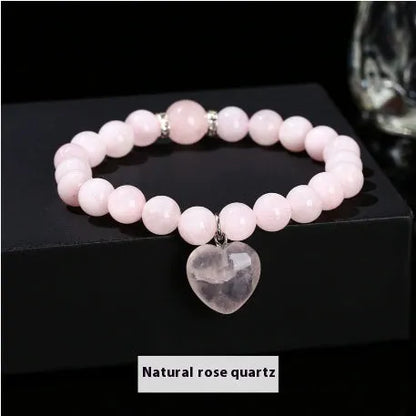 Handmade women's bracelet with natural gemstone beads and a silver love pendant charm.