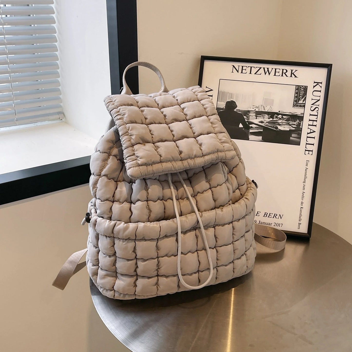 Soft, quilted puffer backpack in a variety of colors, perfect for autumn and winter wear