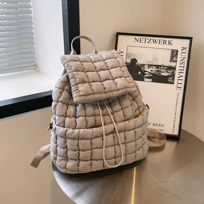 Soft, quilted puffer backpack in a variety of colors, perfect for autumn and winter wear