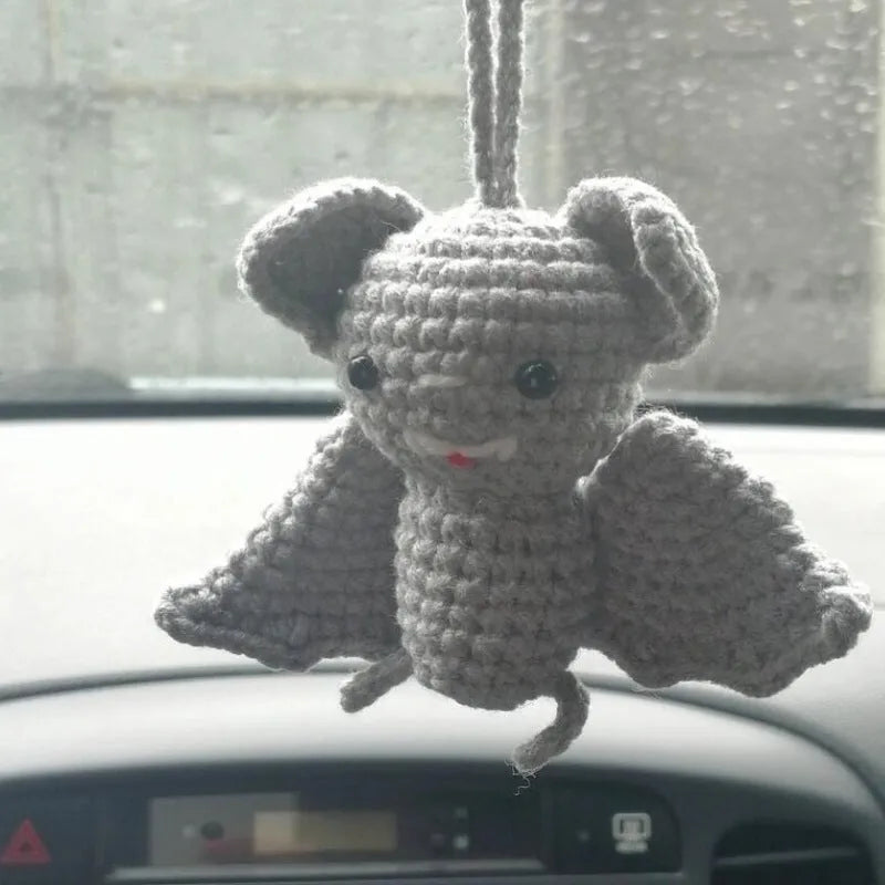 Soft, hand-woven plush car hanging ornament in a cartoon character design.