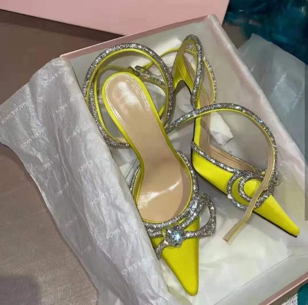 Women's black French style stiletto heel sandals with a silk back bandage and silver buckle closure.