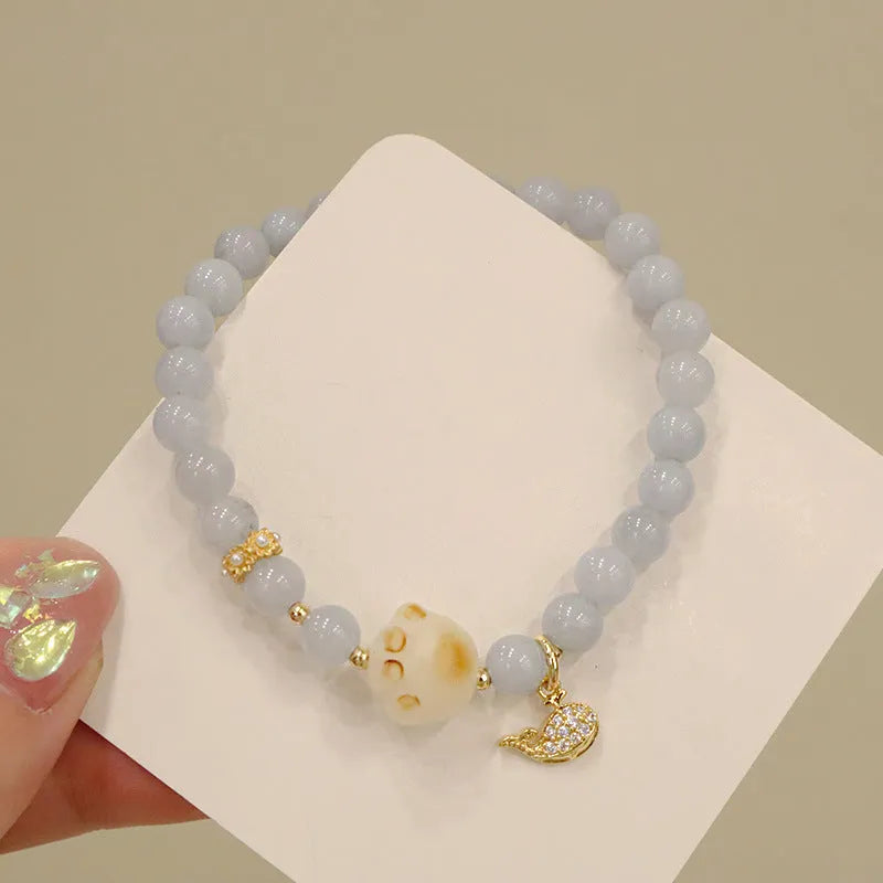 Gold plated women's bracelet with artificial crystal aquamarine chalcedony pendant in climbing cat design