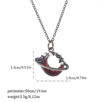 Gothic style zinc alloy necklace with bat pendant on a silver chain against dark background.