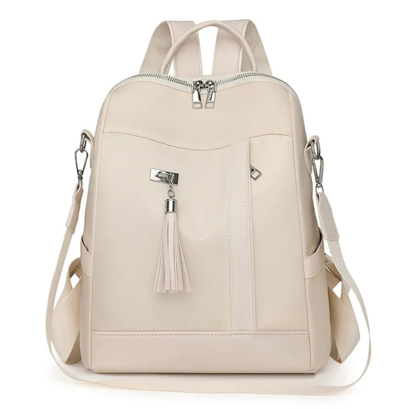 Soft PU commute backpack in light pink colour showing mobile phone pocket and three-dimensional storage design