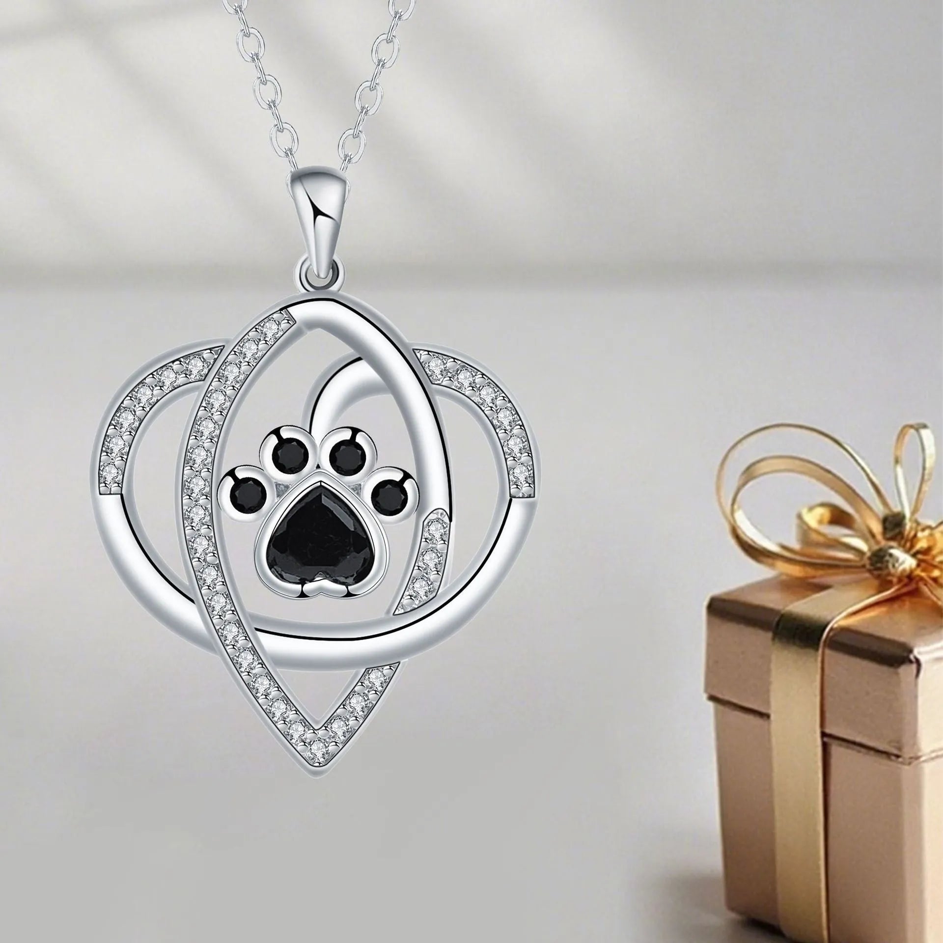 Women's copper necklace with dog paw print pendant on cross chain, electroplated finish