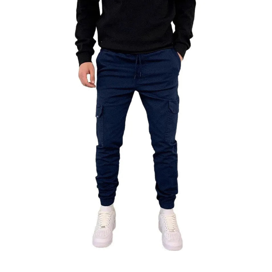 Men's loose-fit casual trousers with elastic waistband and patch pockets in army green colour