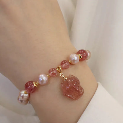 Women's light pink freshwater pearl bracelet with fox charm and zodiac animal design