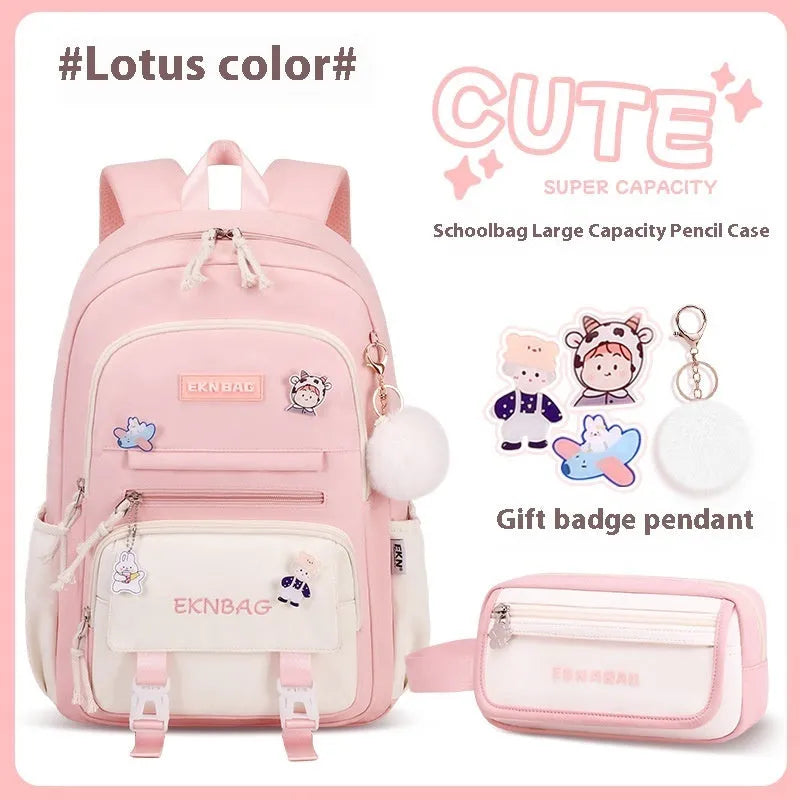 Pink waterproof Oxford cloth school backpack for girls with curved shoulder straps, shown with matching pencil case.
