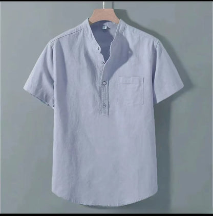 Man wearing a beige loose-fit linen blend casual shirt with a stand collar and short sleeves.