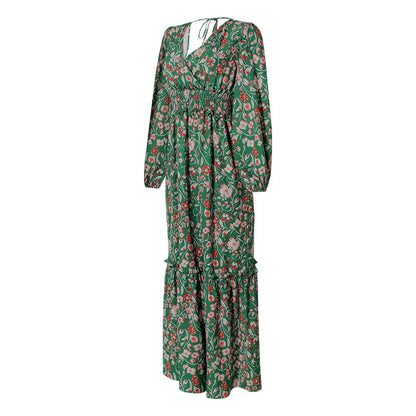 A green halter dress with a vibrant printed pattern and lantern sleeves.