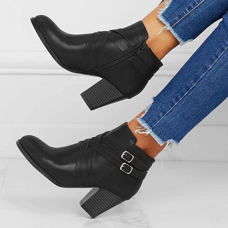 Women's plus size black PU leather short ankle boots with a 7cm heel and side zipper.