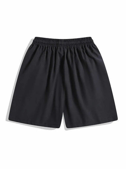 Men's black loose-fit quick-dry sports shorts with elastic waist, shown above the knee.