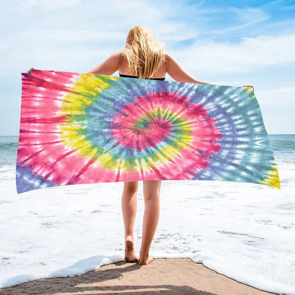 Square beach towel with tie-dye pattern showing superfine fibre texture and vibrant colours