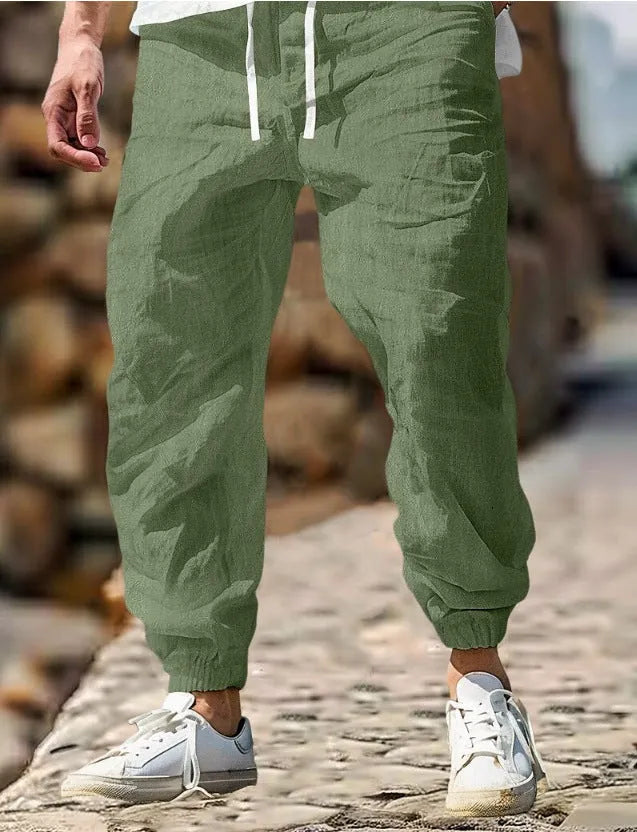 Men's straight-leg cotton trousers with elastic waist in Army Green colour, showing classic fit and summer-appropriate fabric.
