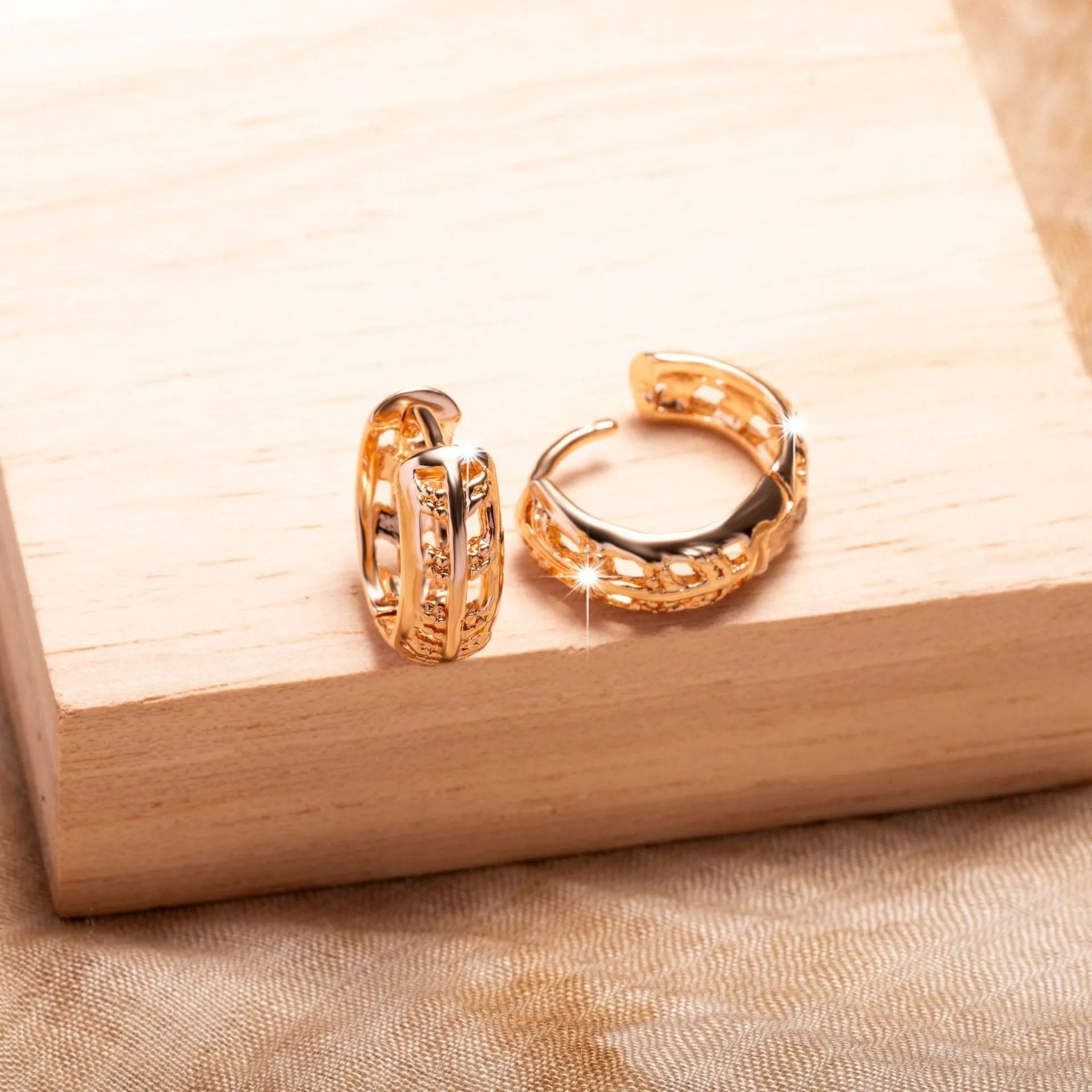Copper heart and leaf shaped earrings with hollowed-out design and rose gold finish