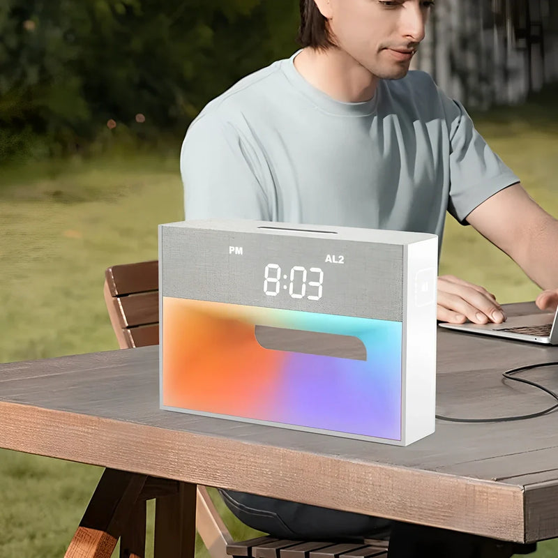 Wireless mobile phone bracket speaker with colourful atmospheric lighting that charges devices via USB connection while providing hands-free viewing at adjustable angles