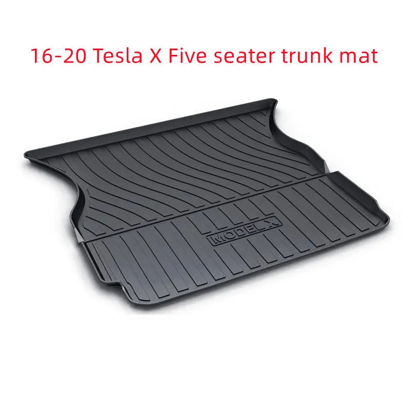 Black TPE rubber floor mats for Tesla Model 3, showing deep grooves and raised edges on driver's side.