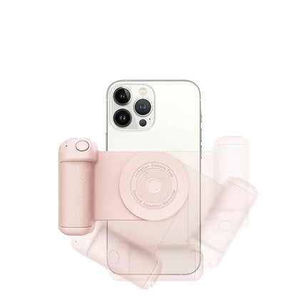 Black magnetic phone camera grip holder with rotatable stand on a table next to a smartphone.