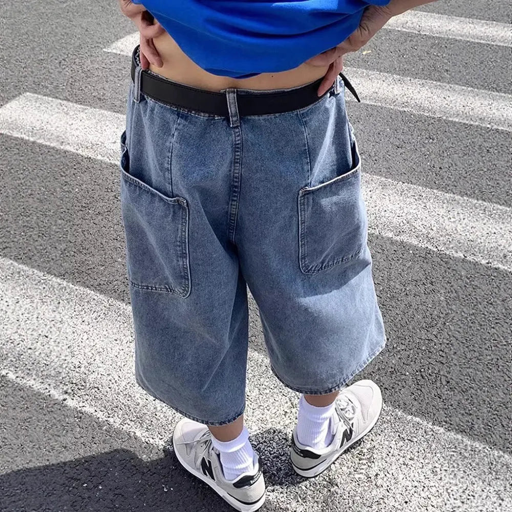 Men's blue washed denim shorts with high waist, cropped length, straight leg, and zipper fly
