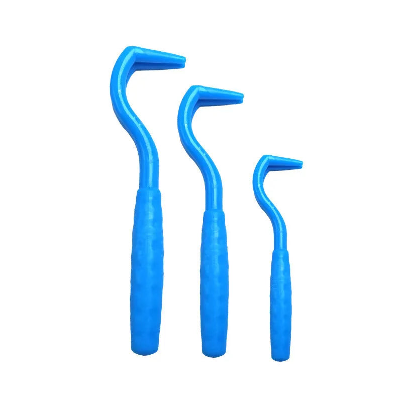 Set of three coloured tick hook removal tools for dogs on a white background.