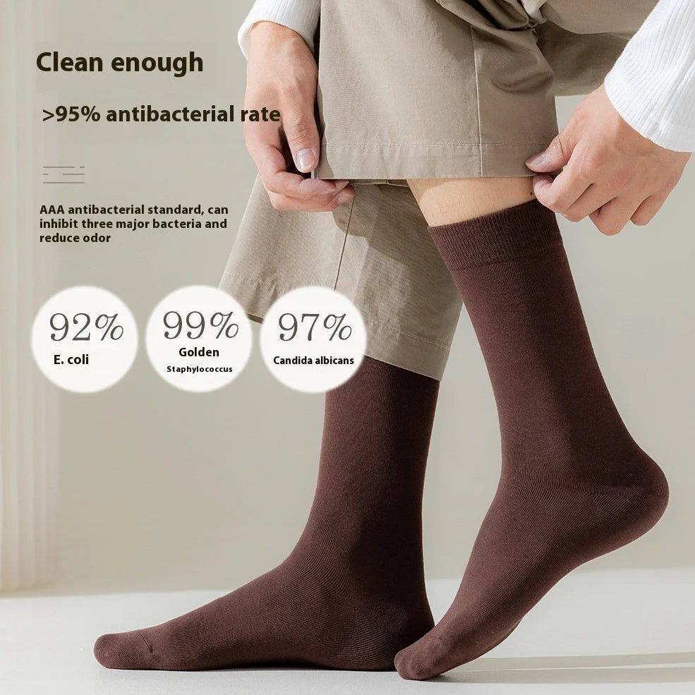 Mid-calf business socks in solid colours with combed cotton construction and deodorant function