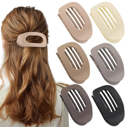 Six rose red plastic hair clips with frosted grip surface and geometric quadrilateral design