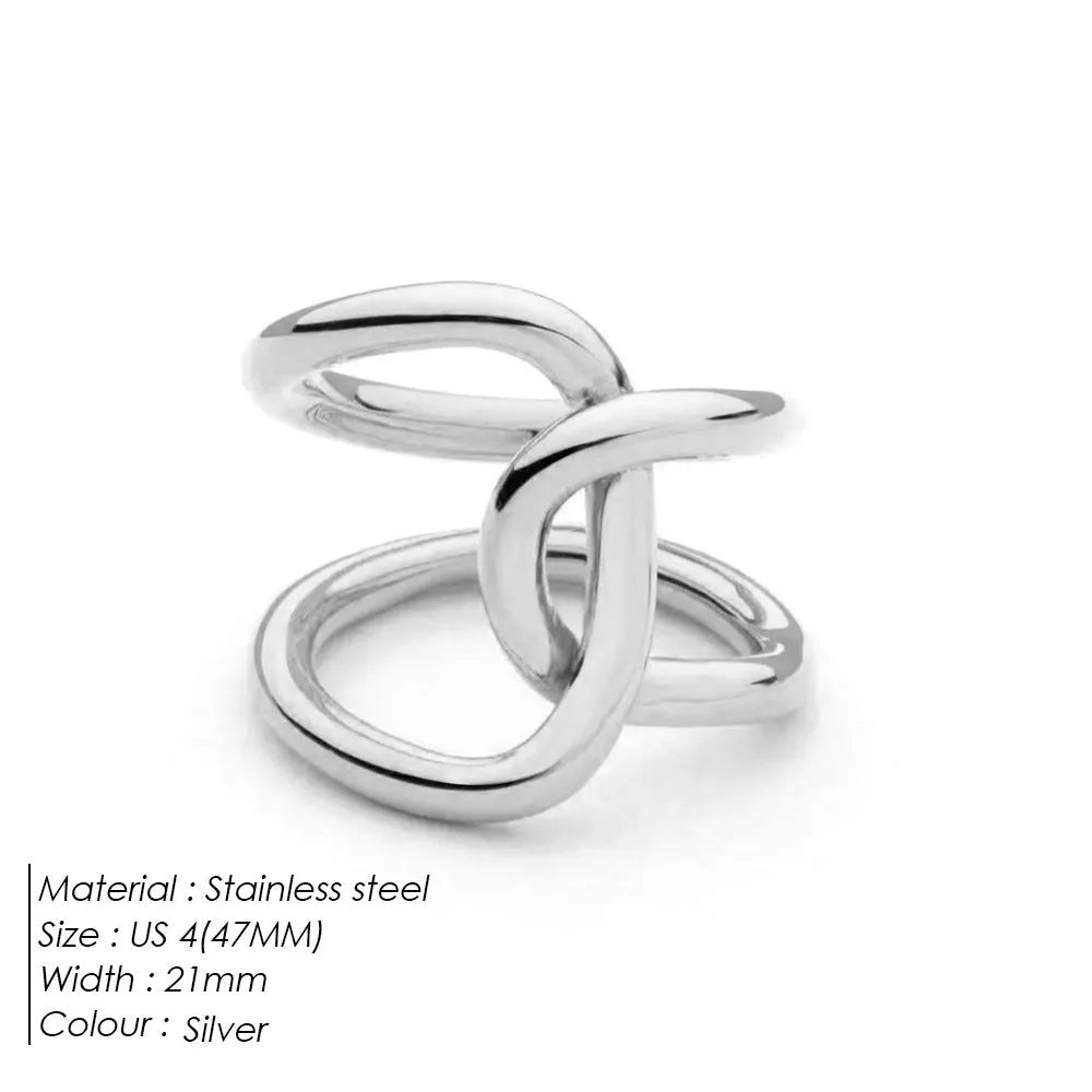 Knotted adjustable stainless steel ring for women in gold or steel colour on a grey background.