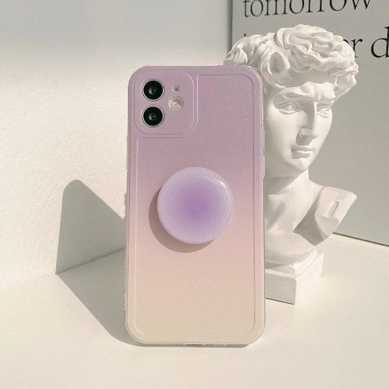 Yellow to purple gradient silicone iPhone case with a pop-out kickstand deployed.