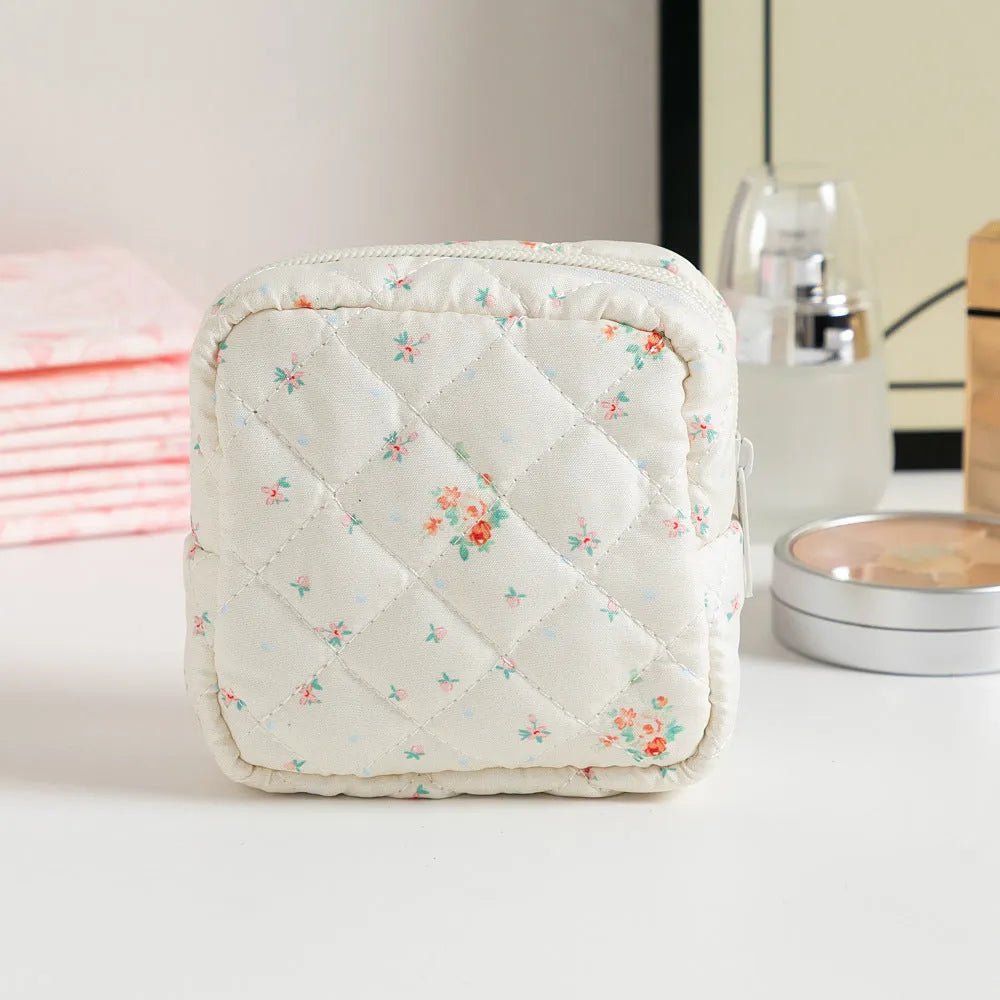 Women's key storage bag with floral patterns including cherry on white background design