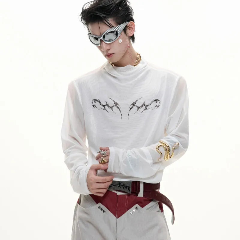 Man wearing a black slim-fit niche mesh long sleeve base layer shirt.