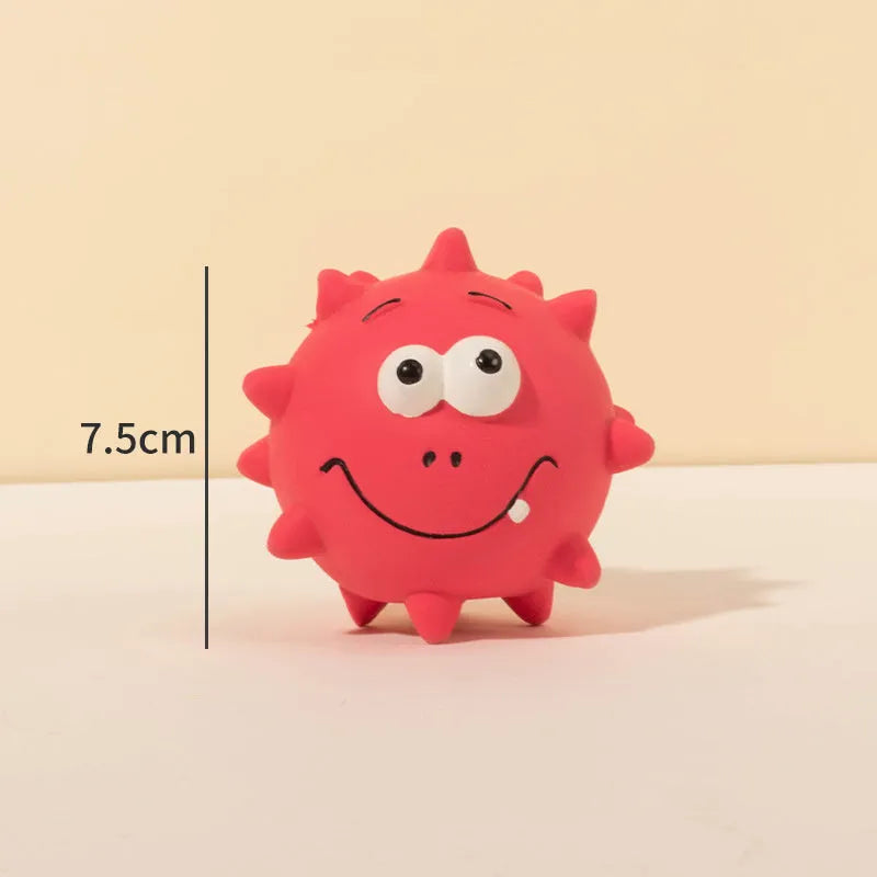 Four coloured natural latex dog balls with textured surfaces and cute faces, each measuring 7.5cm in diameter