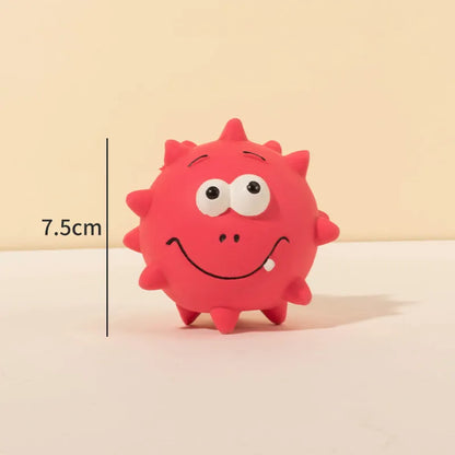 Four coloured natural latex dog balls with textured surfaces and cute faces, each measuring 7.5cm in diameter
