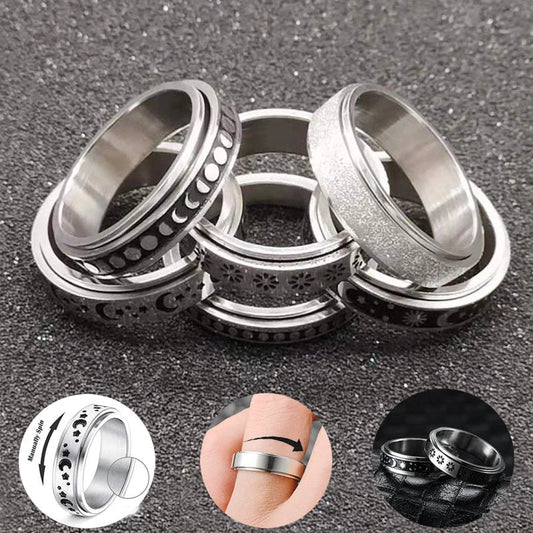 Stainless steel spinner ring with intricate moon and stars design
