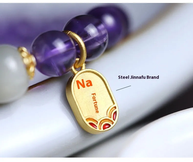 Purple amethyst crystal bead bracelet with geometric shape on an adjustable chain.