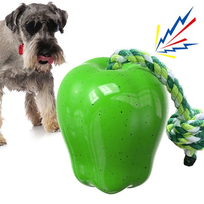Green squeaky apple-shaped dog toy with treat-dispensing function, approximately 10-12cm diameter
