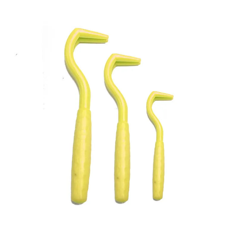 Set of three coloured tick hook removal tools for dogs on a white background.