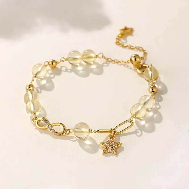 Women's mobius loop bracelet made with natural grey moonstone, strawberry quartz, or citrine crystal beads in a constellation design.