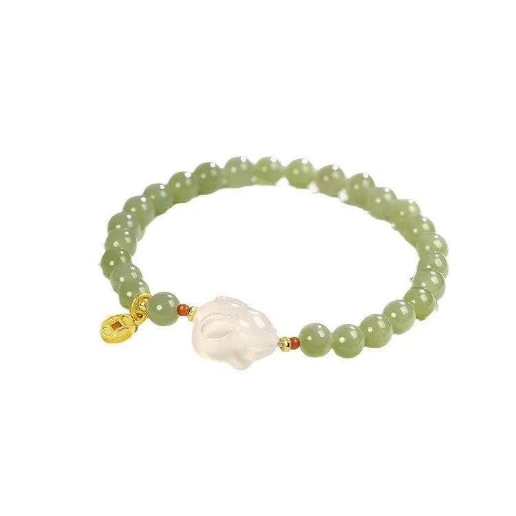 Handmade Hetian jade rabbit charm bracelet for women in glass or coloured glaze with a sweet rabbit design.