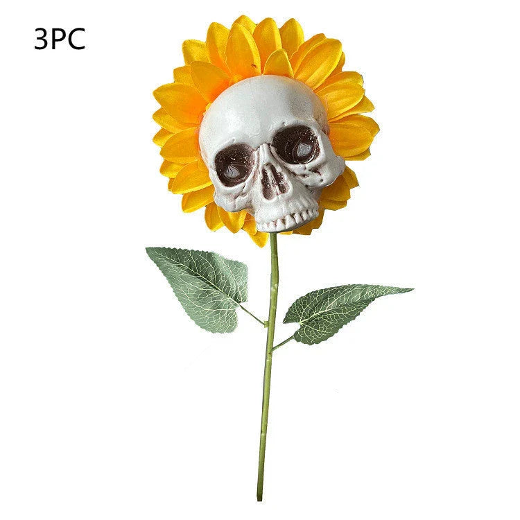 A group of skull-shaped sunflower ornaments arranged in a Halloween-themed outdoor display
