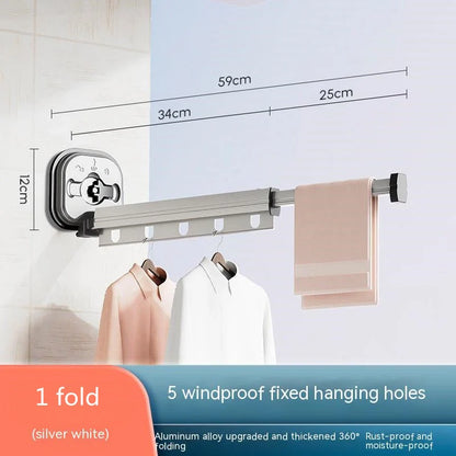 Aluminum retractable drying rack mounted on a window, extending outward for clothes drying