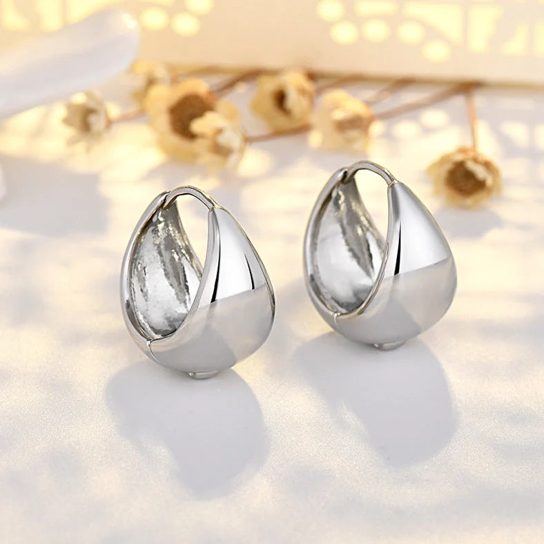 Women's geometric circle earrings with gold inlay treatment and water drop ear clip design