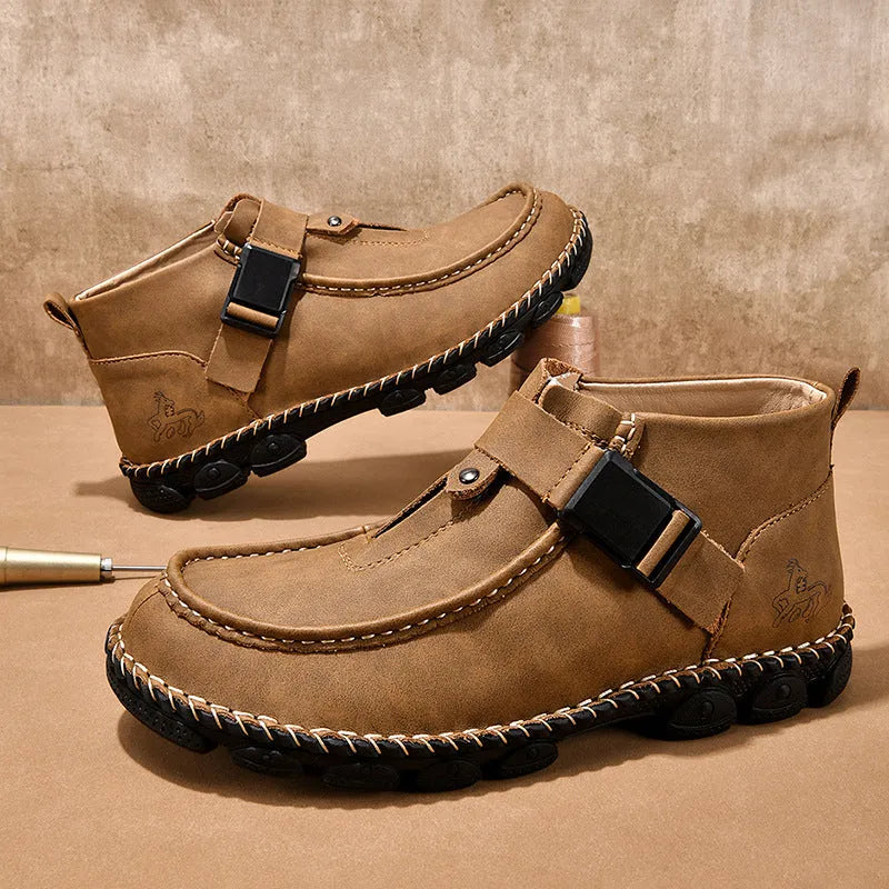 Casual flat bottom slip on shoes in brown with visible handmade sole stitching on a wooden floor.