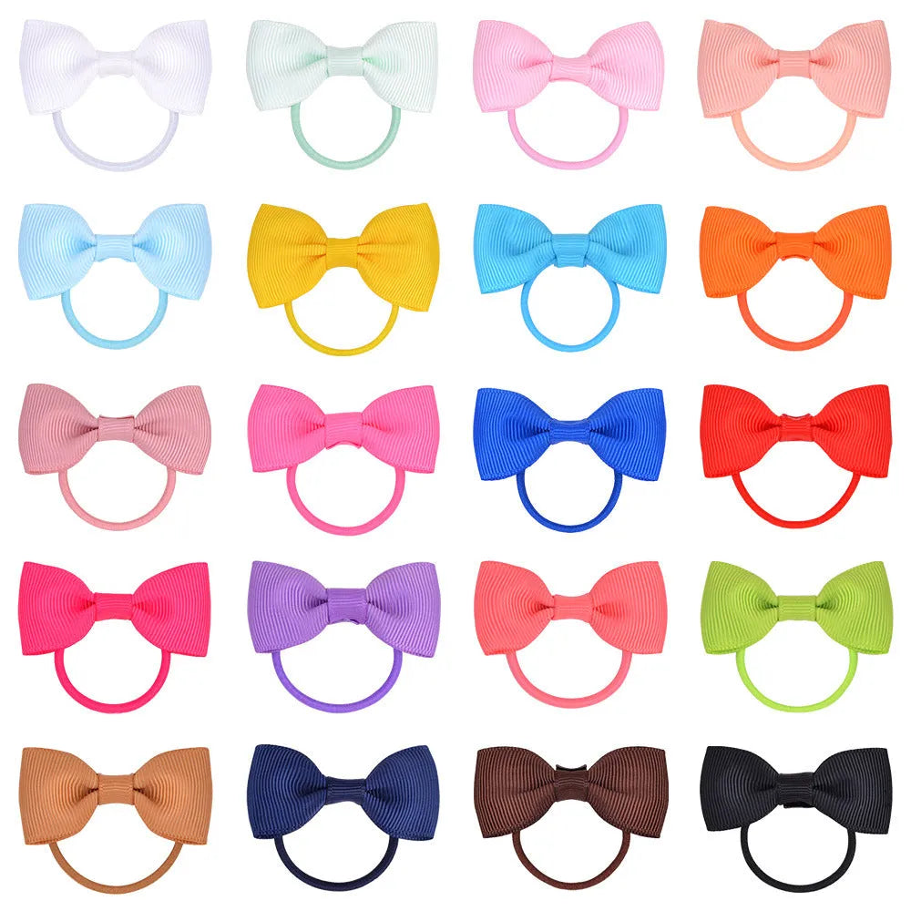 Multi-coloured assortment of 80 baby hair ties with grosgrain ribbon bows for infants and toddlers.