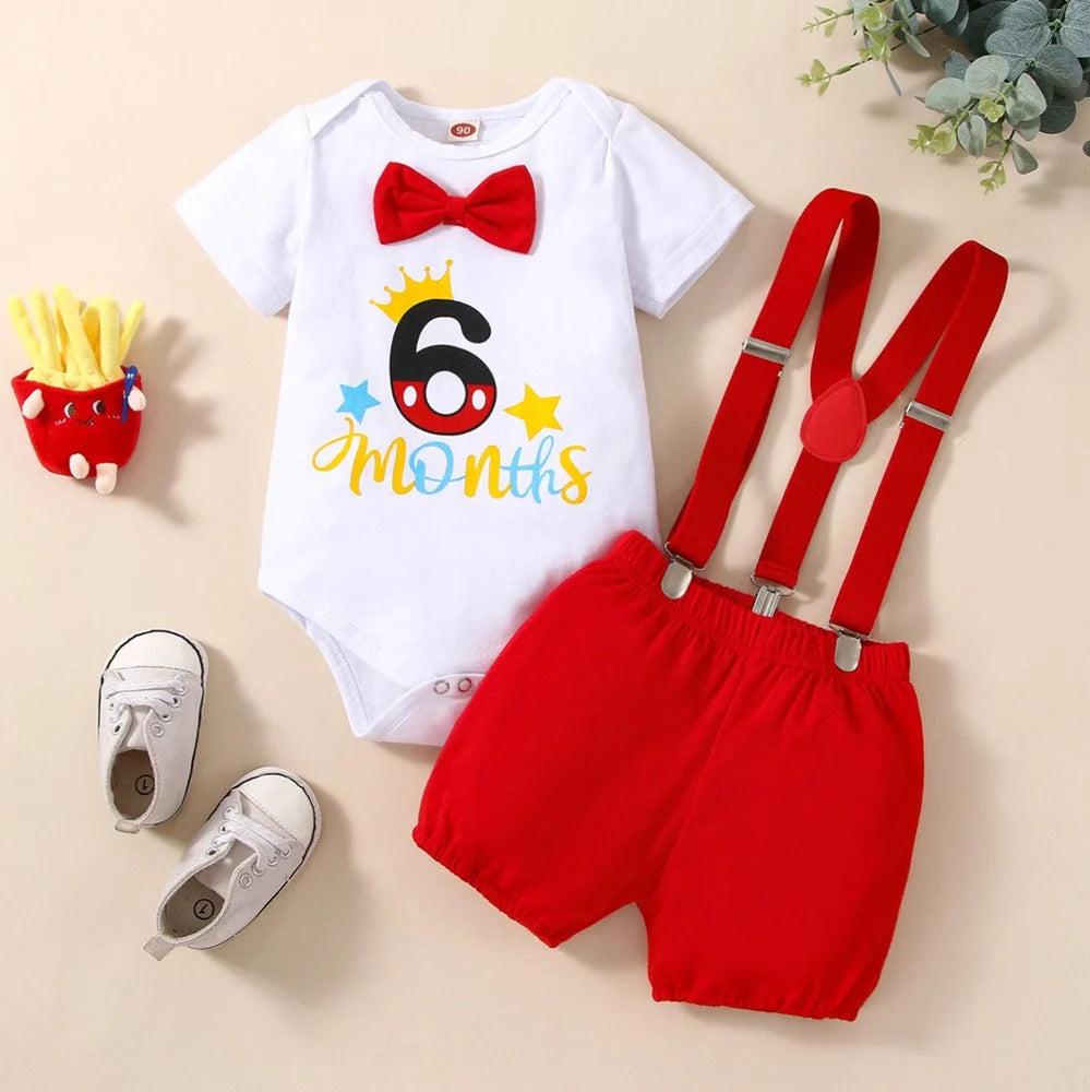 Red cotton baby romper with suspender shorts and printed letters for birthday celebrations