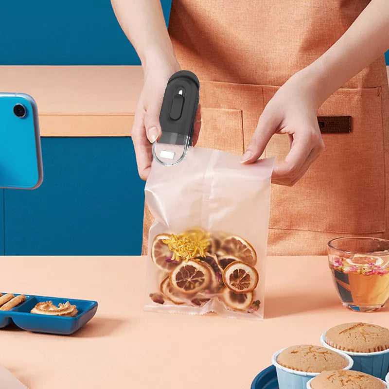 Handheld portable food bag sealer in black, white, and Lake Blue