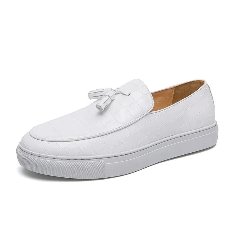 Men's black sneakers with tassel detailing, round toe, and rubber sole for business casual settings
