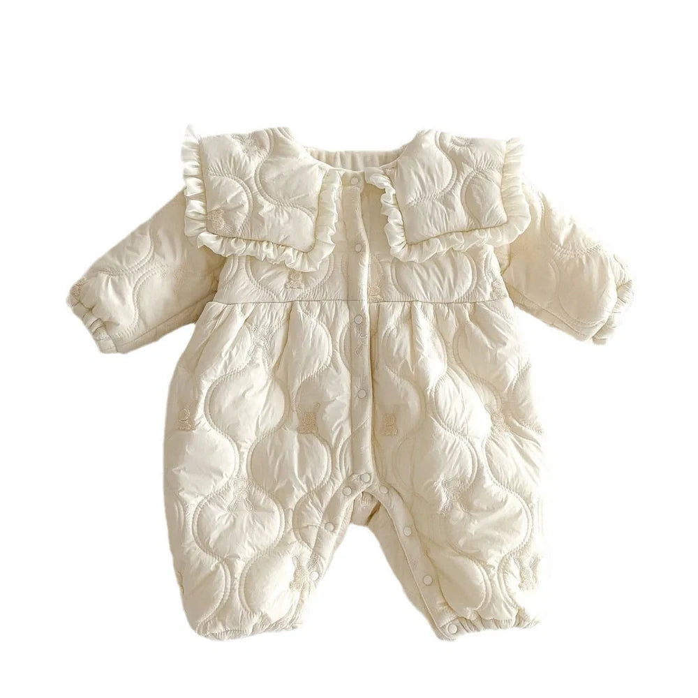 Newborn in light beige fleece-lined quilted cotton jumpsuit with single-breasted closure
