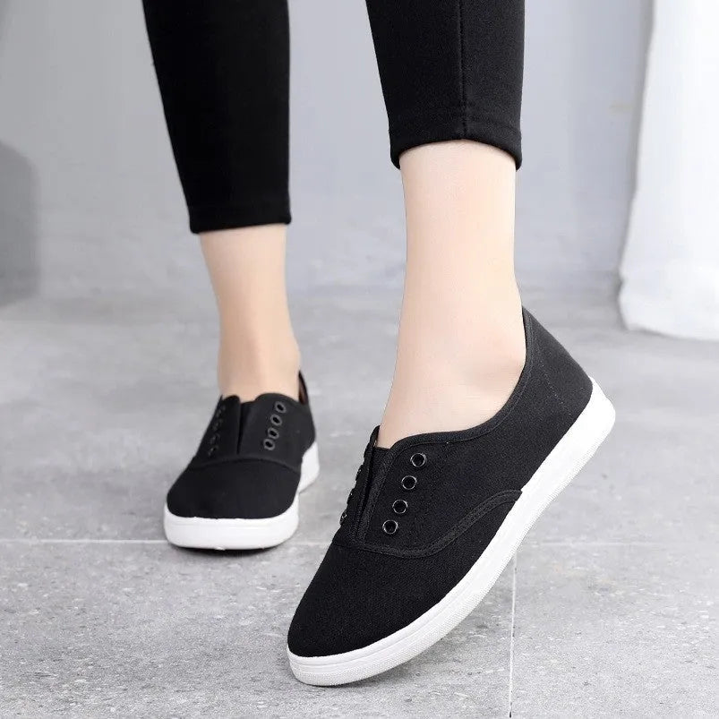 Low-top canvas casual shoes in various colours on a flat sole.