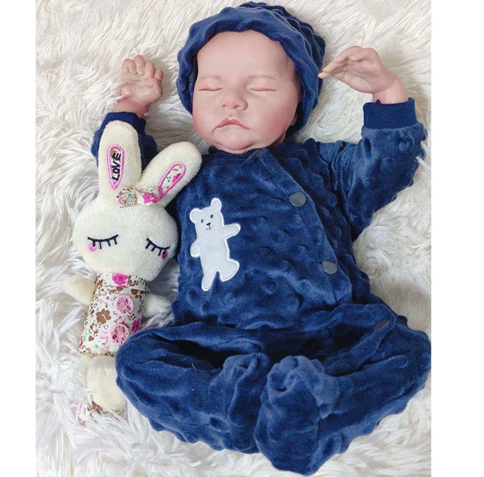 18-inch reborn doll with cloth body and hand-painted vinyl head wearing pink romper