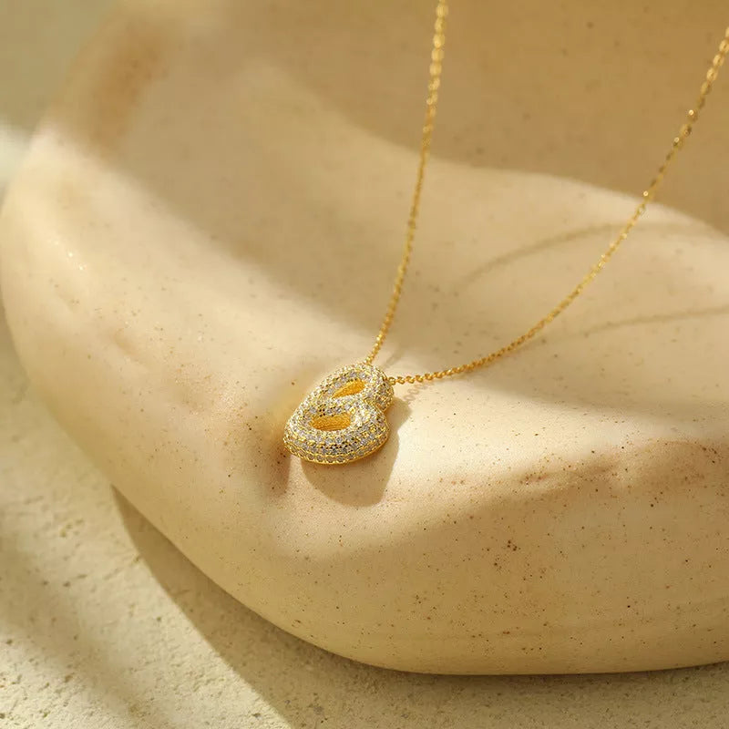 Stainless steel initial pendant necklace with zircon accents, personalized with your choice of letter.